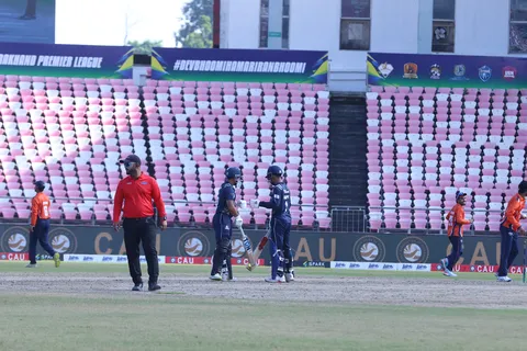 Nainital Tigers players with the umpire during play